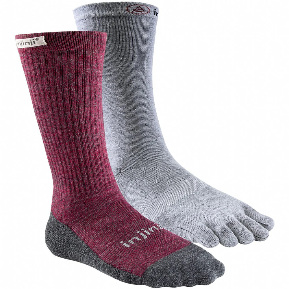 Red and grey sock next to a white five-toe sock on a white background