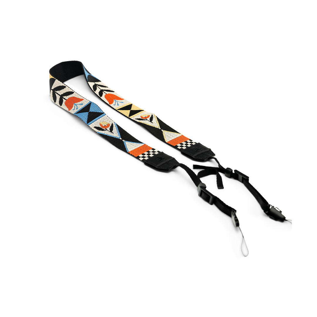Camera strap with geometric floral pattern on a white background