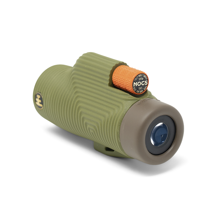 Green and beige monocular with a Nocs logo on a white background