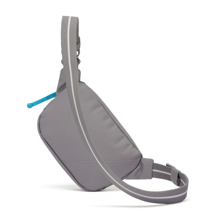 Reverse of a grey sling bag with a blue zip pull on a white background