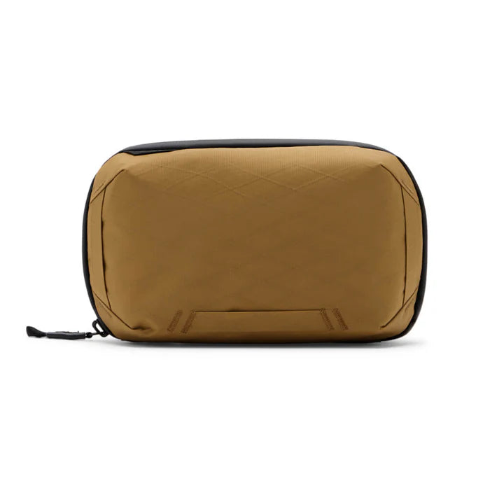 A tan waterproof pouch with black trim and a black zipper pull, shown from the front on a white background.