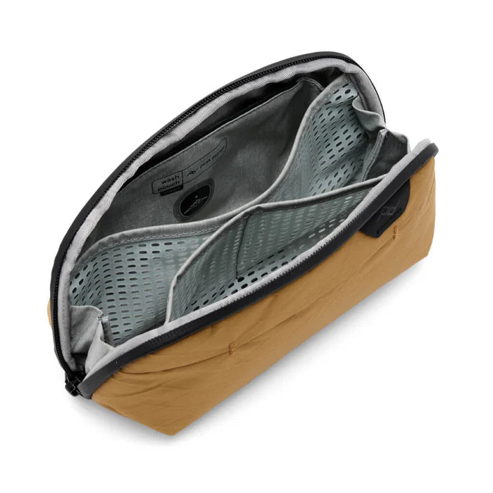 Open beige toiletry bag with gray interior on a white background