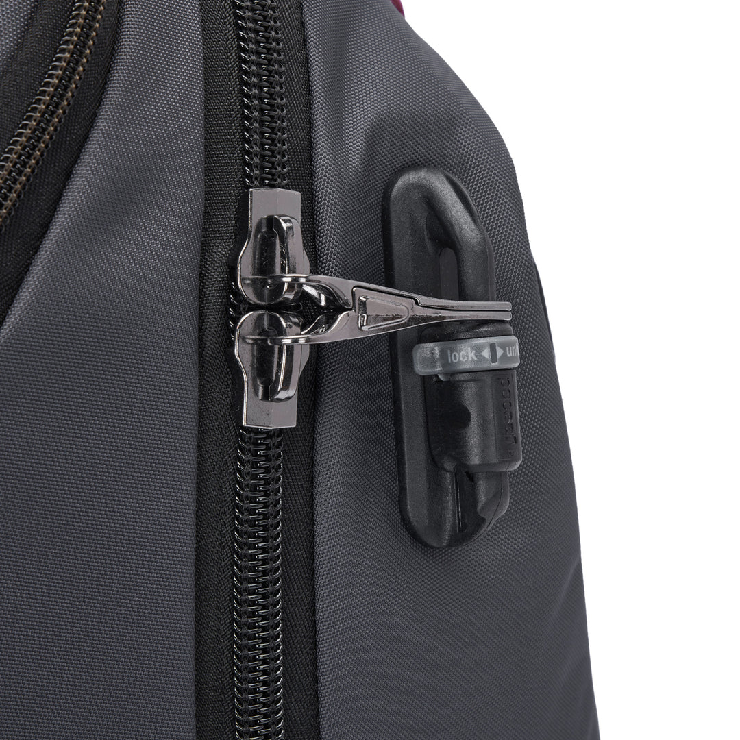 Close of the zipper pulls on a grey backpack, both clipped through a releasable latch