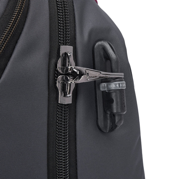 Close of the zipper pulls on a grey backpack, both clipped through a releasable latch