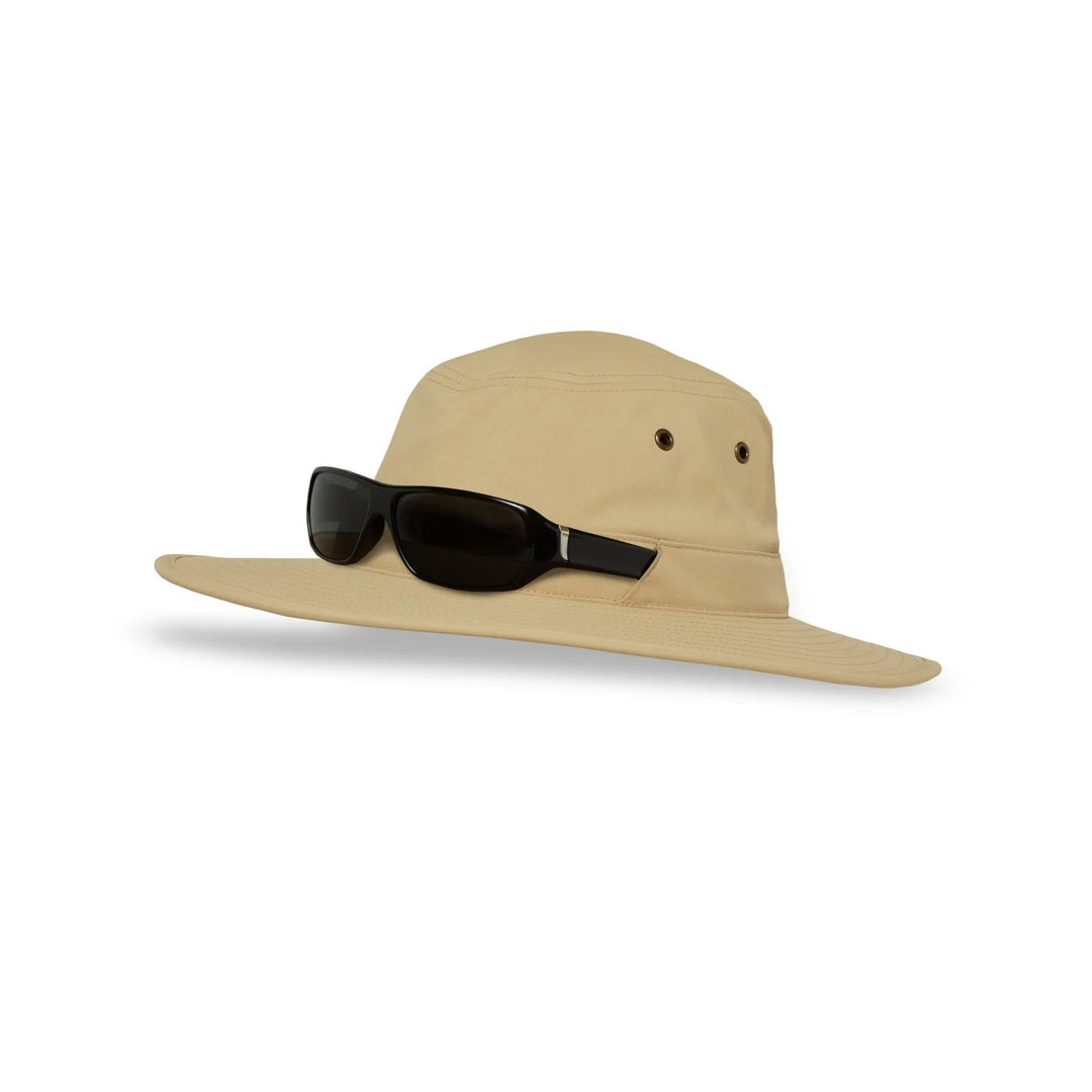 A beige wide-brimmed sun hat with a black strap sunglasses resting on the brim, shown against a plain white background.