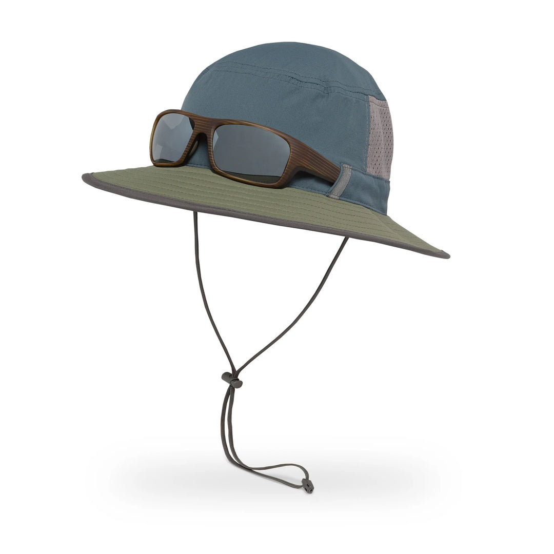 Green and blue wide-brimmed hat with sunglasses on a white background