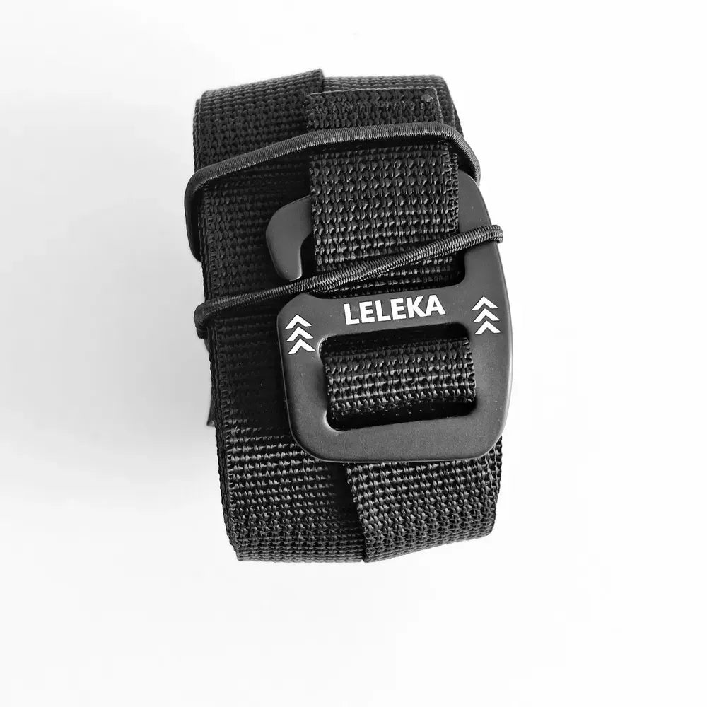 Rolled up black hammock straps with Leleka branding on a white background. 
