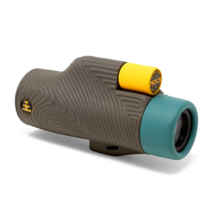 Monocular with yellow and teal ends on a white background