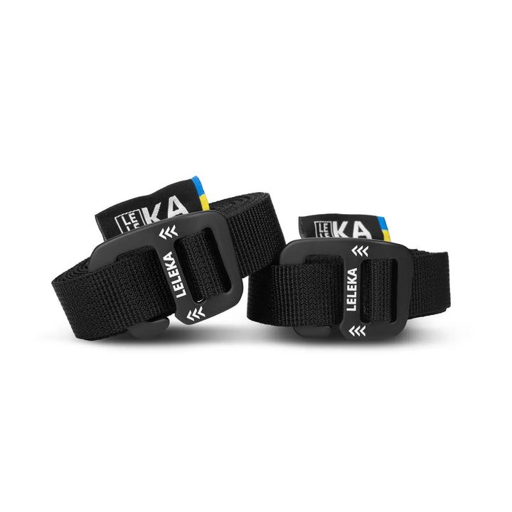 Black rolled up hammock strap with Leleka branding on a white background
