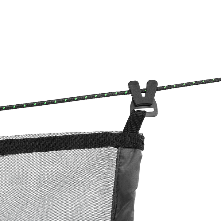 Close-up of a mesh screen with a black clip on a white background