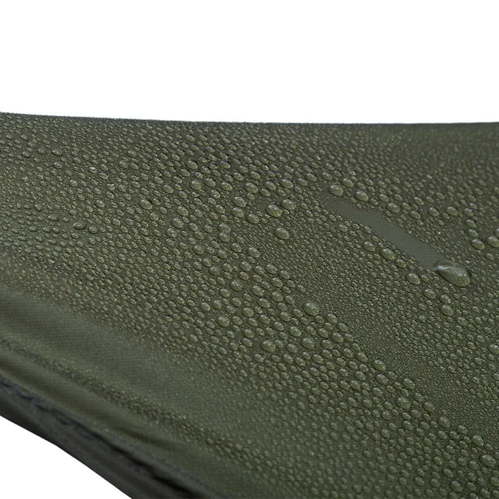 Close-up of an olive green waterproof fabric surface covered with water droplets on a white background.