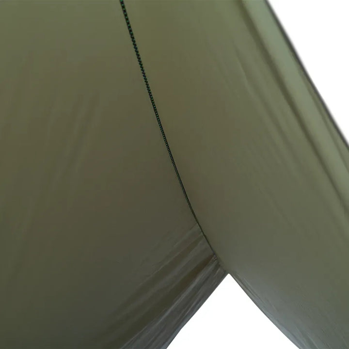 Close-up of a dark olive tarp with a visible seam on a white background