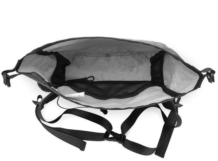 Black backpack with straps on a white background