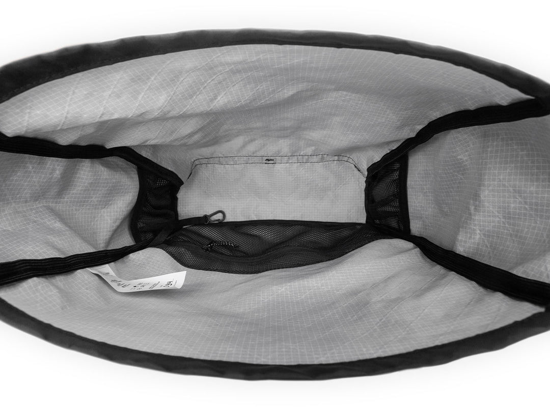 Close-up of a gray mesh bag with black drawstrings on a white background