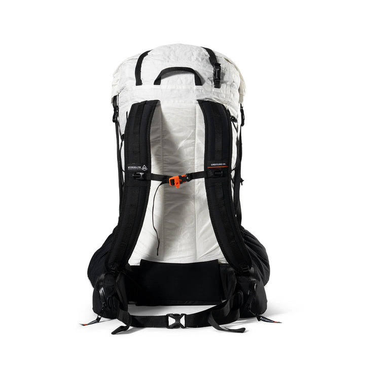 The rear view of a technical hiking backpack in white and black, featuring a breathable white shell, black padded shoulder straps, a black hip belt, and an orange quick-release buckle on the compression strap.