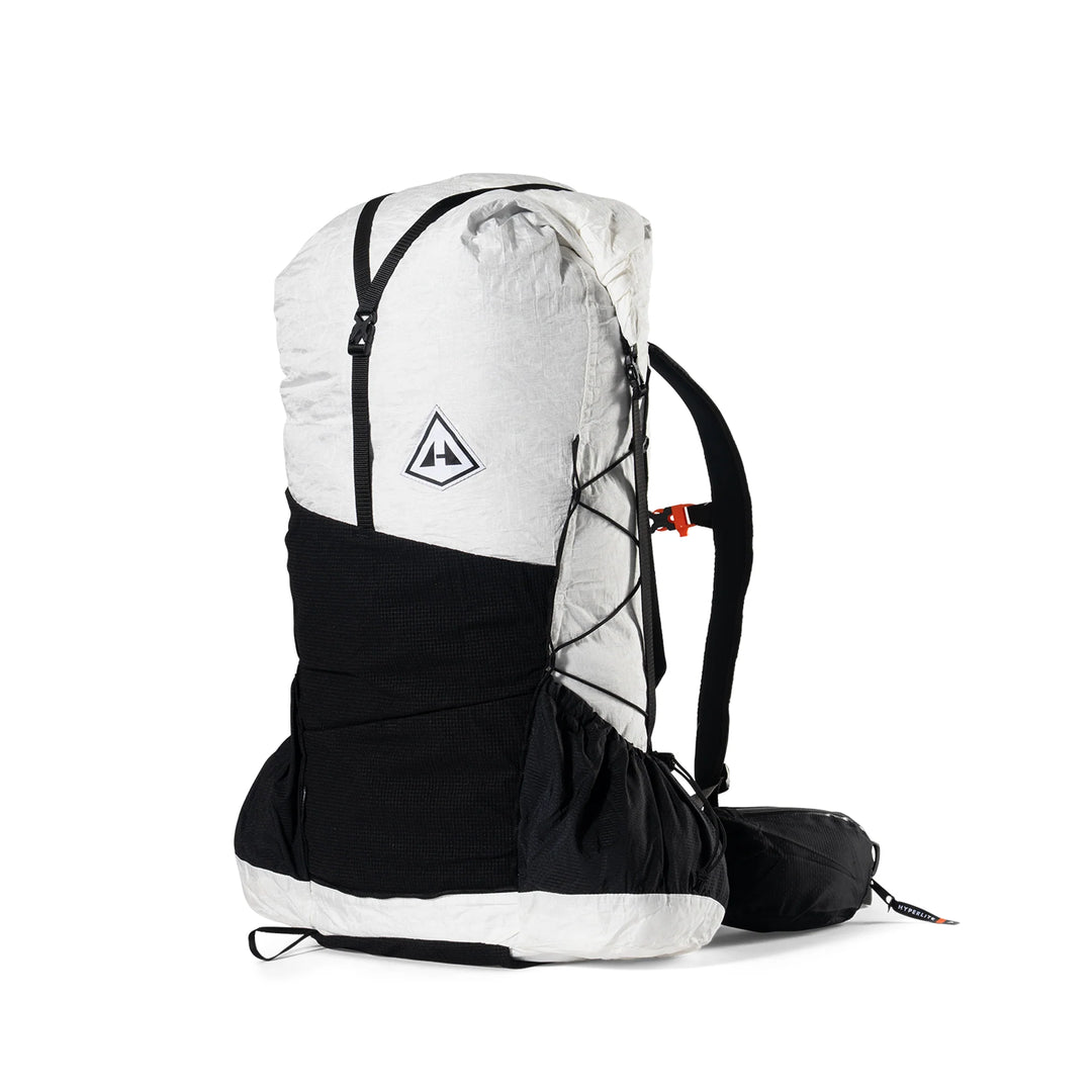 A technical outdoor backpack shown from the side against a plain white background. The backpack features a dual-tone design with a light heather gray top section and a solid black lower section, including the shoulder straps and hip belt.