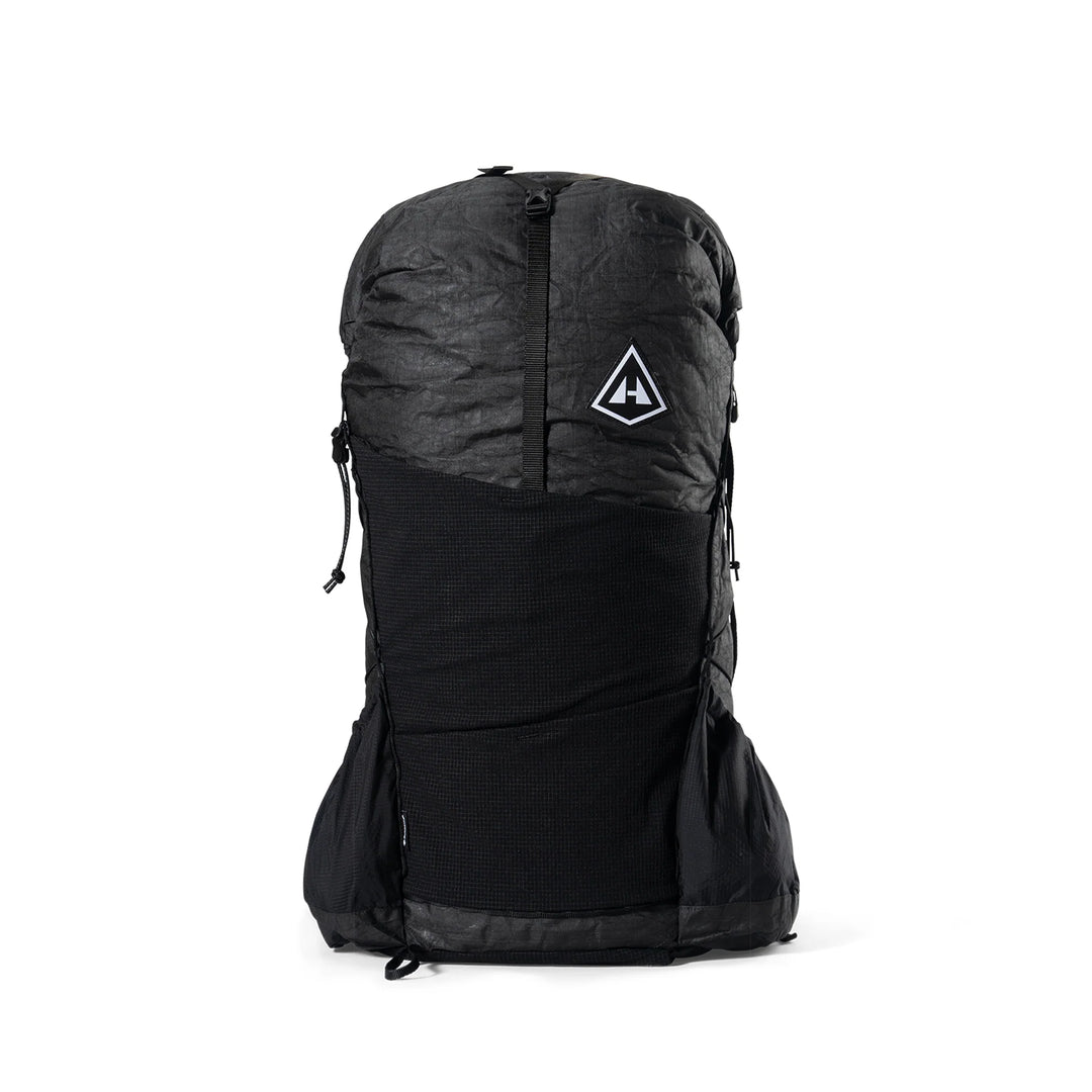 A black waterproof backpack cover with a white triangular logo on the front, shown on a clean white background.