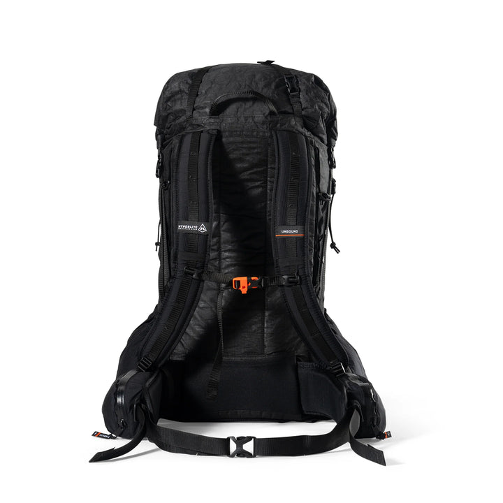 A black technical hiking backpack shown from the back, featuring padded shoulder straps, compression buckles, and an orange quick-release buckle, photographed on a clean white background.