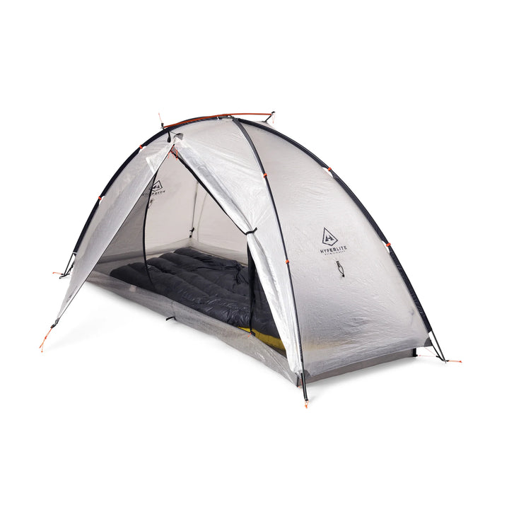 A one-person dome camping tent with a transparent gray fly sheet and black rainfly, shown with a dark sleeping bag inside. The brand name &