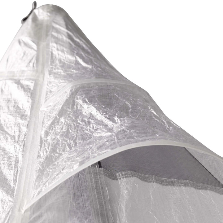 Close-up of the top of a grey transparent tent with a white background