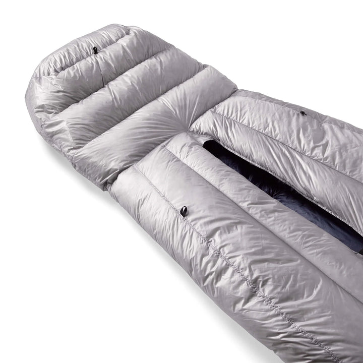 Roll of white sleeping bag on a white background