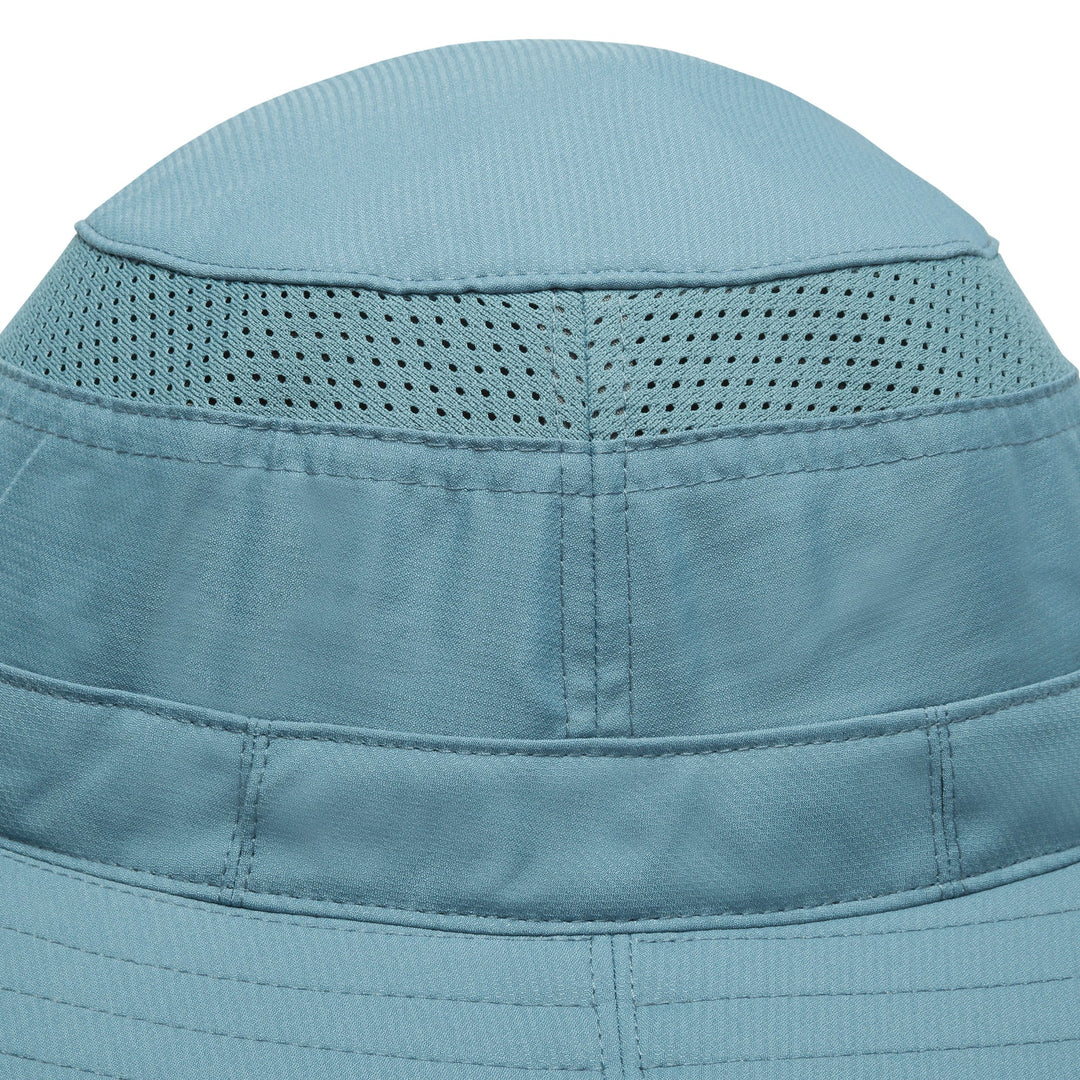 Close-up of the crown of a light blue sun hat, showing the fabric texture, stitched panel seams, and perforated ventilation mesh.