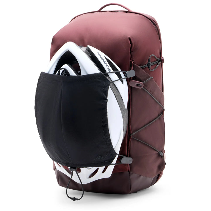 Maroon backpack with a helmet and black pocket on a white background 