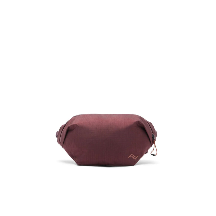 Maroon waist bag on a white background