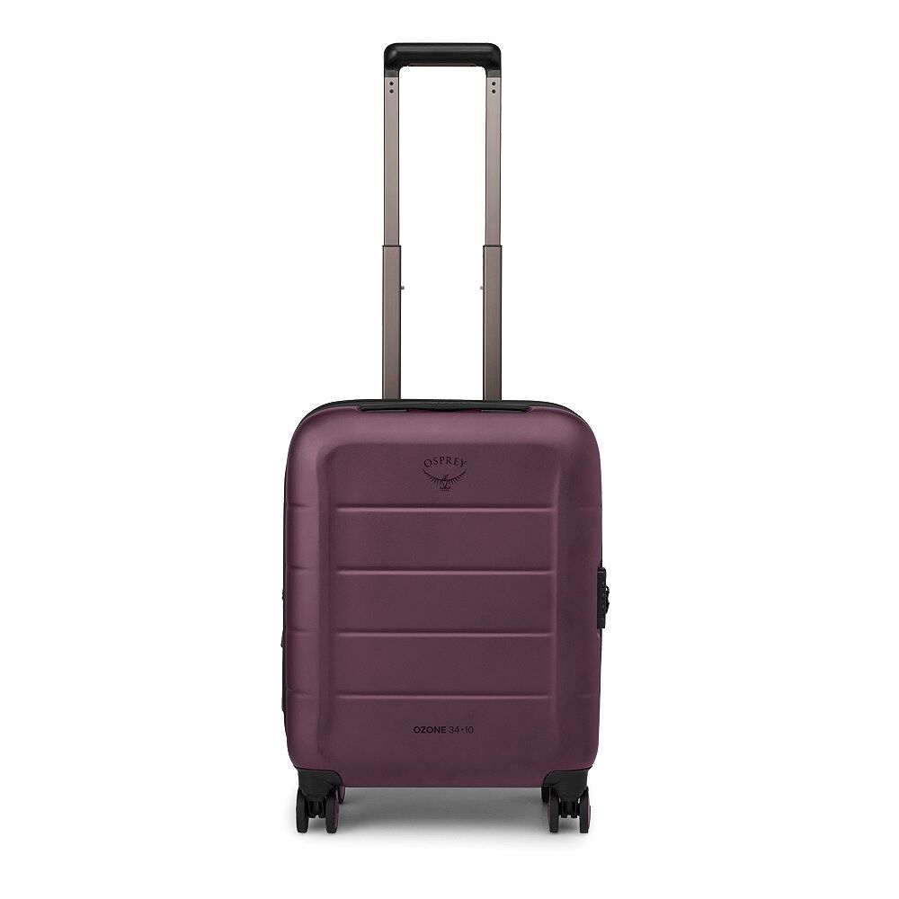 A purple Osprey hardshell spinner suitcase with an extended telescoping handle, shown against a plain white background.