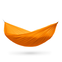 A bright orange camping hammock suspended between two points against a plain white background with a soft shadow underneath.