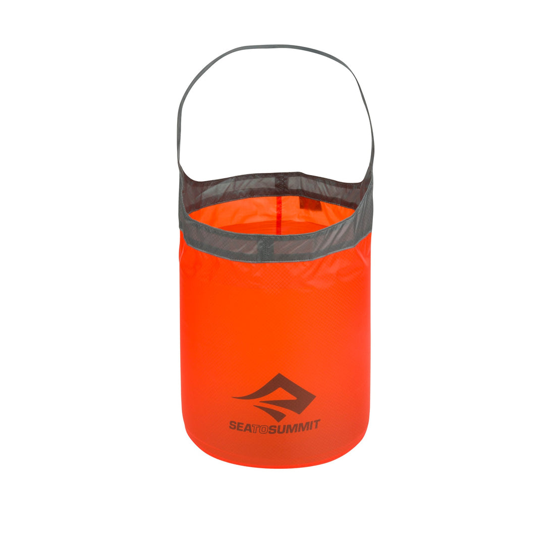 Orange folding bucket with gray rim on a white background