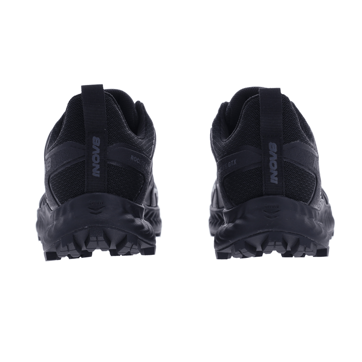 Back of a pair black hiking shoes with INOV8 branding