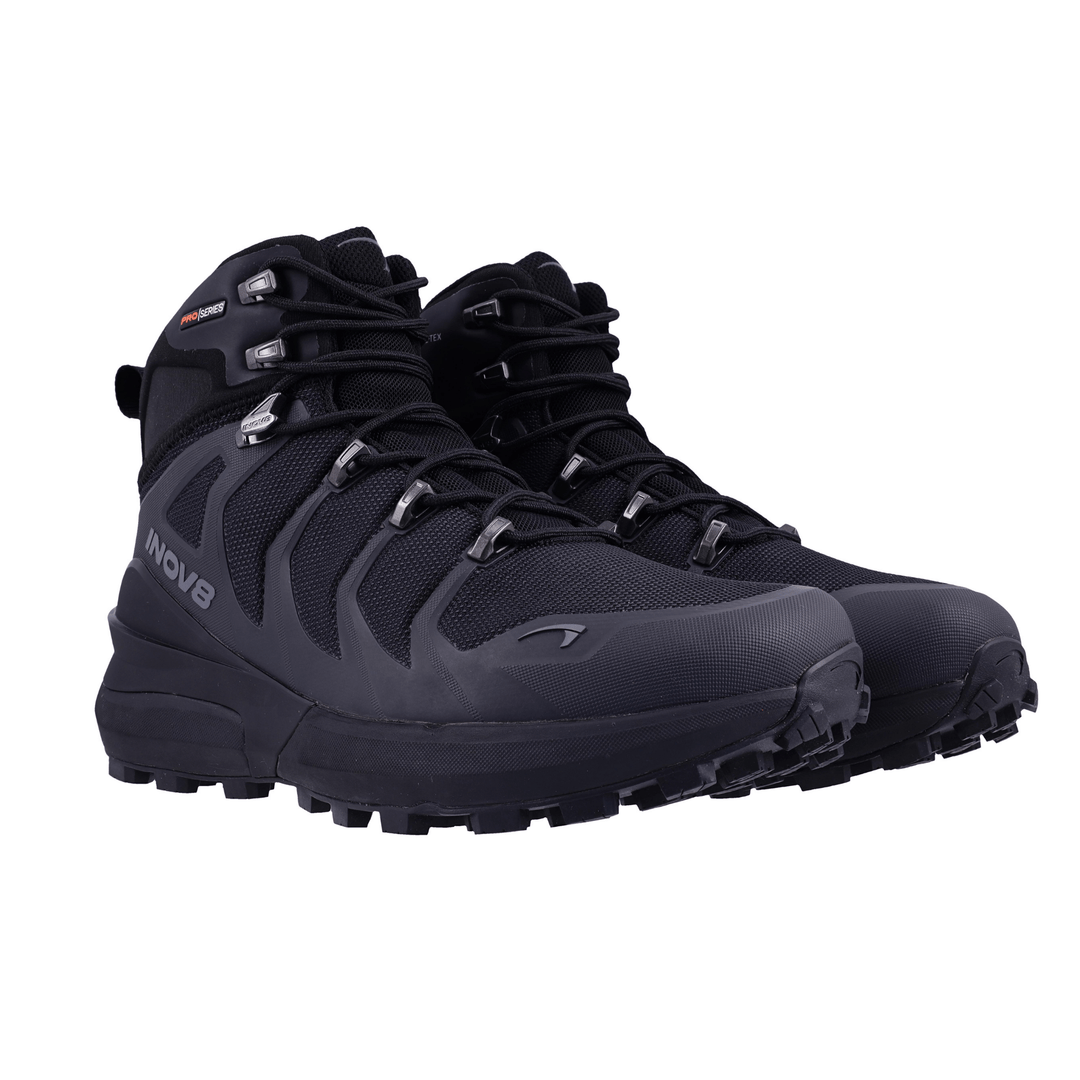 Pair of black hiking boots on a white background