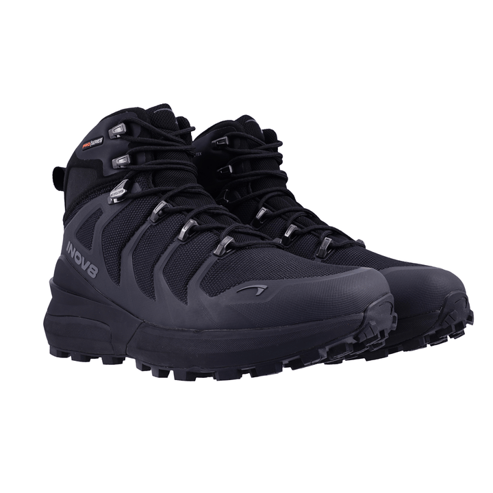 Pair of black hiking boots on a white background