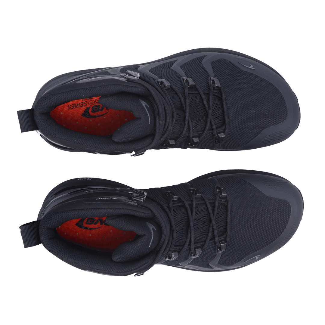 Birdseye view of a pair of black hiking boots with red insoles on a white background