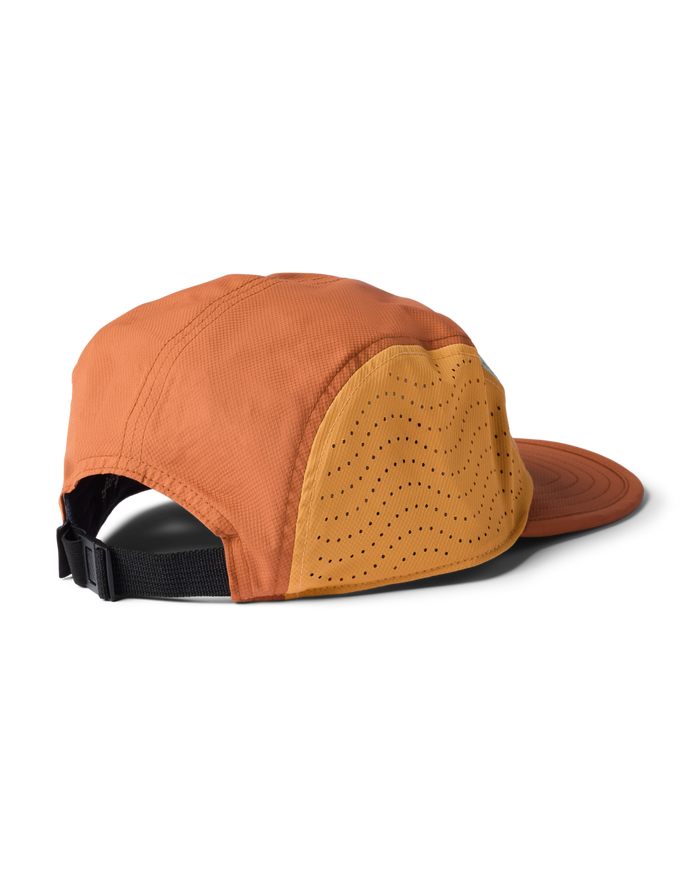 Orange cap with a black strap on a white background