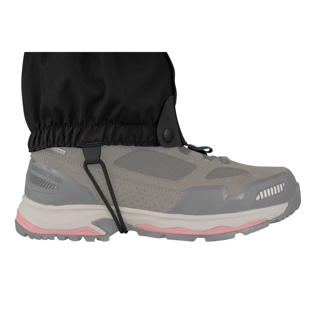 Gray hiking shoe with black gaiters on a white background
