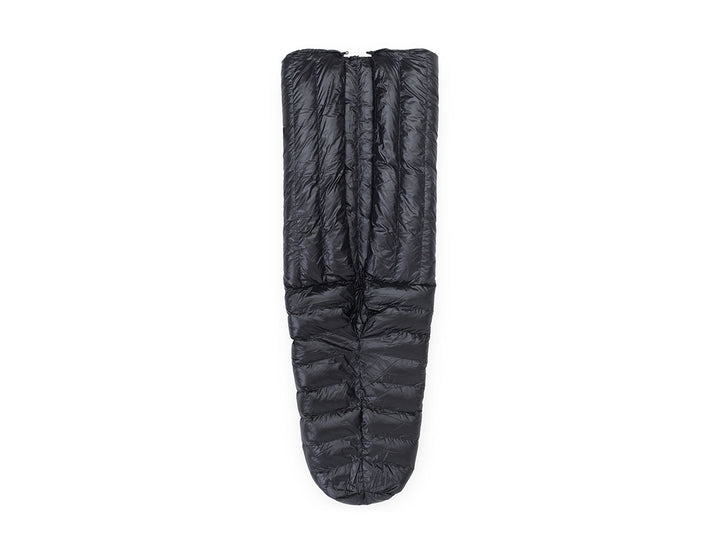 Black sleeping bag on a beige background