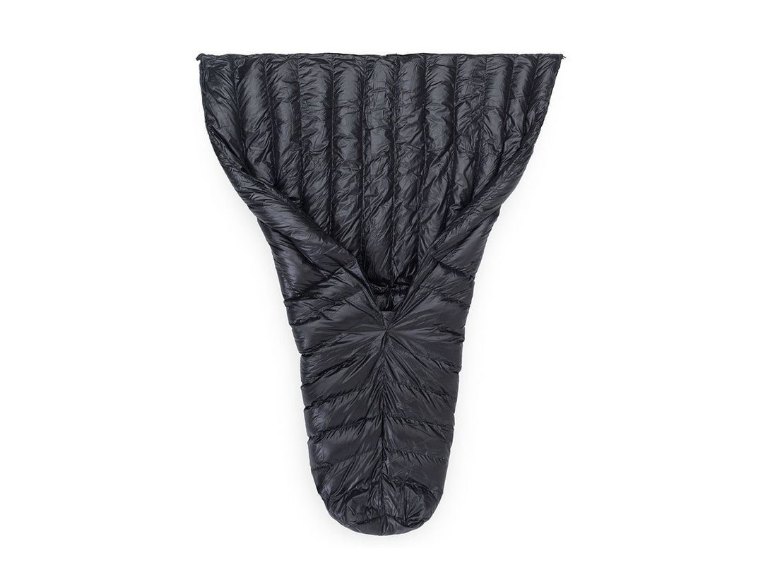 A black quilt shown laid flat against a solid white background.