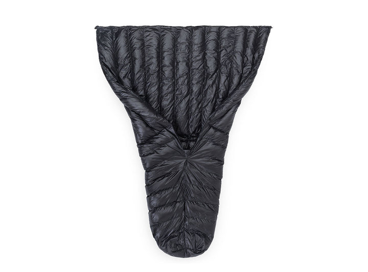 A black quilt shown laid flat against a solid white background.