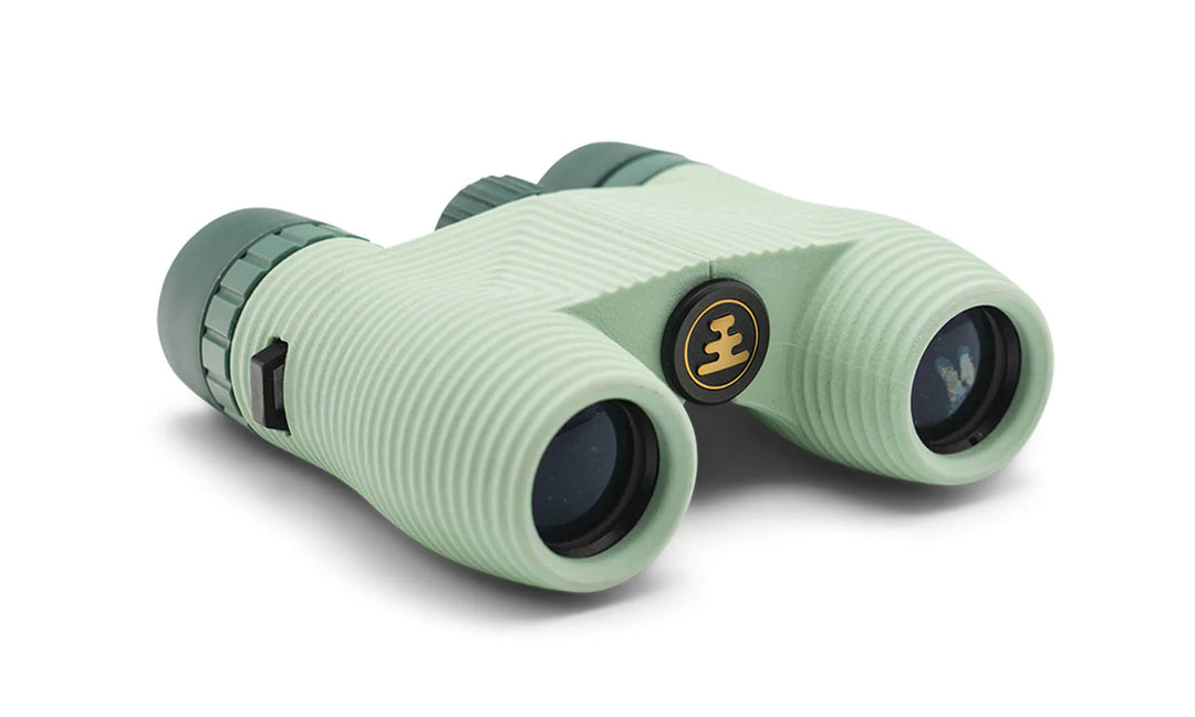 Green binoculars with a brand logo on a white background