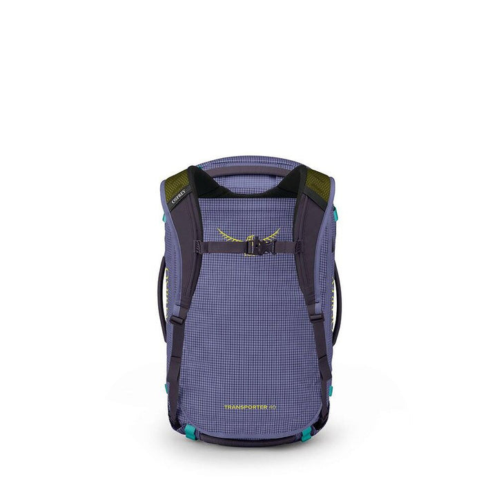 A purple and black Osprey Transport backpack shown from the back, featuring a grid-patterned fabric body, dark shoulder straps, and small yellow and teal accents.