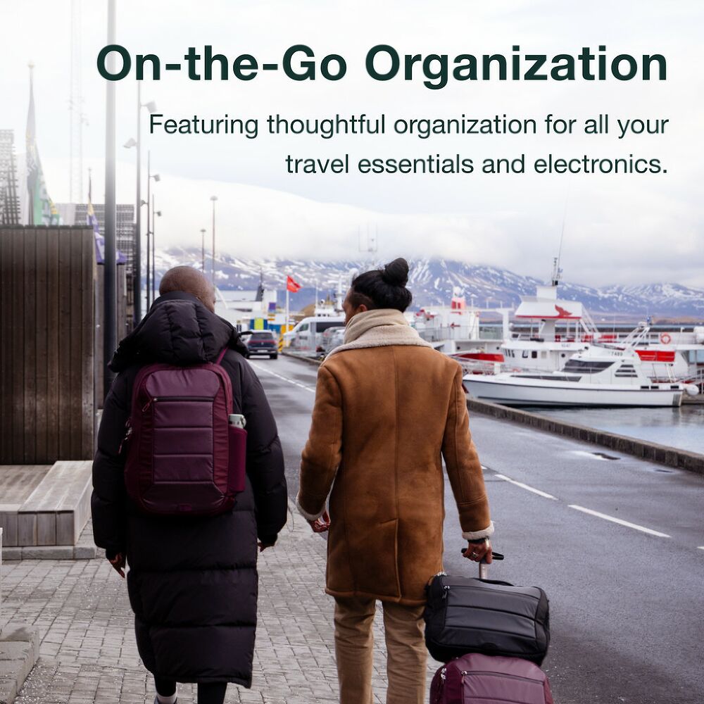 Two people walking with luggage and backpacks on a city street, with text about travel organization.