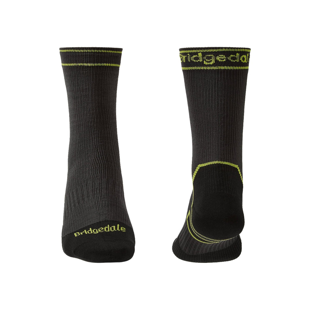 Pair of black socks with yellow accents and 'Bridgedale' branding on a white background