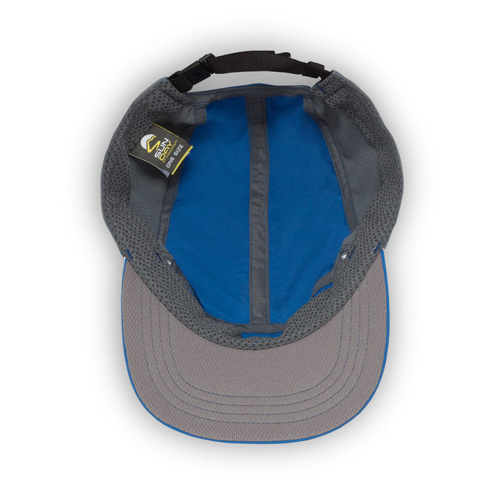 Inside of grey and blue cap with a visible brand tag on a white background