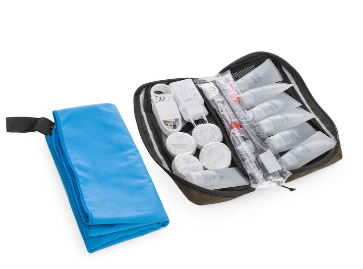 Toiletry bag with bandages and supplies on a white background