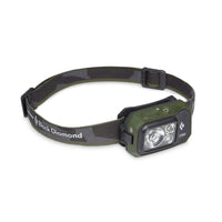 Dark green and black head torch on a white background